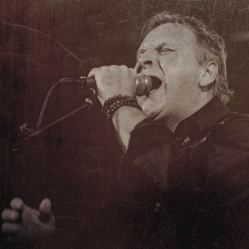 Renegade's lead singer mid-song, sepia live photo