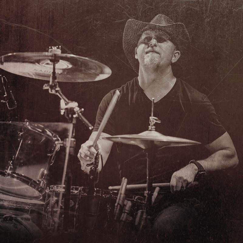 Renegade drummer in a straw cowboy hat